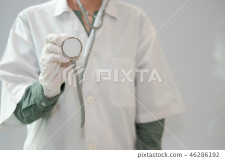 doctor physician medical practitioner with stethoscope to auscultate breath or checkup at clinic hospital 46286192