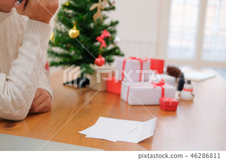 man thinking with pensive expression. christmas decoration at xmas new year holiday celebration. man thinking with pensive expression. christmas decoration at xmas new year holiday celebration. 46286811