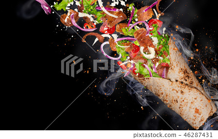 Kebab sandwich with flying ingredients. Kebab sandwich with flying ingredients. 46287431
