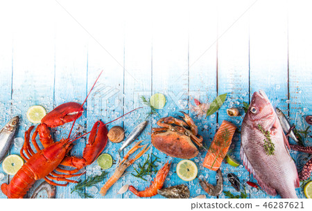 Fresh tasty seafood served on old wooden table. 46287621