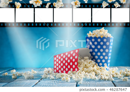 Boxes of popcorn on blue background. Boxes of popcorn on blue background. 46287647