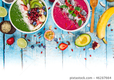 Smoothie bowl with fresh berries, nuts, seeds, fruit and vegetables. Smoothie bowl with fresh berries, nuts, seeds, fruit and vegetables. 46287664
