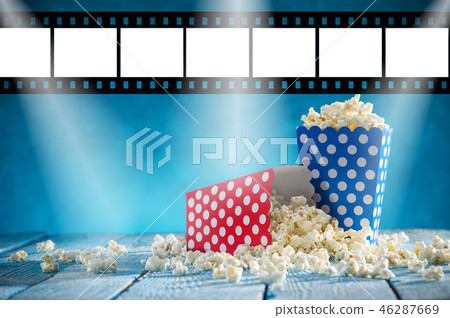 Boxes of popcorn on blue background. Boxes of popcorn on blue background. 46287669