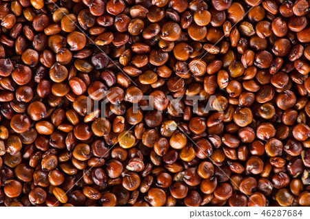 Red quinoa seeds on white wooden table. 46287684