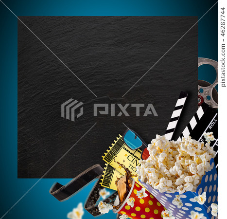 Pop-corn, movie tickets, clapperboard and other things in motion. 46287744