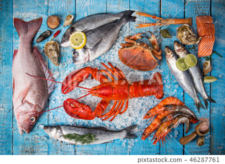 Fresh tasty seafood served on old wooden table. 46287761