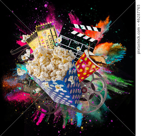 Pop-corn, movie tickets, clapperboard and other things in motion. Pop-corn, movie tickets, clapperboard and other things in motion. 46287765