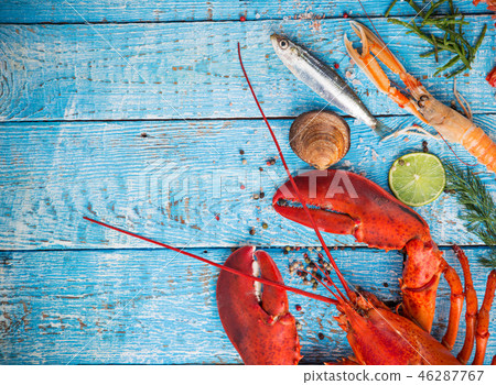 Fresh tasty seafood served on old wooden table. Fresh tasty seafood served on old wooden table. 46287767
