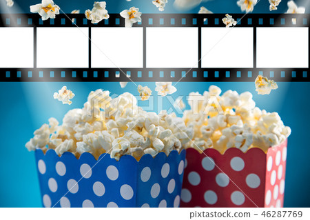 Boxes of popcorn on blue background. Boxes of popcorn on blue background. 46287769