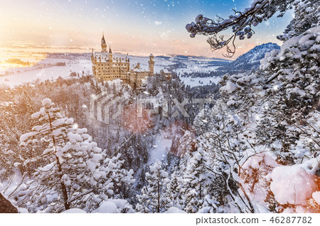 Neuschwanstein Castle during sunrise in winter landscape. Neuschwanstein Castle during sunrise in winter landscape. 46287782
