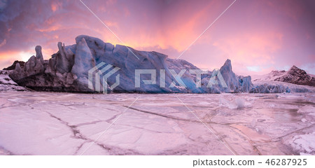 Famous Fjallsarlon glacier and lagoon with icebergs swimming on frozen water, sunset. Famous Fjallsarlon glacier and lagoon with icebergs swimming on frozen water, sunset. 46287925