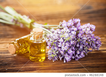 Wellness treatments with lavender flowers on wooden table. Wellness treatments with lavender flowers on wooden table. 46288148