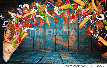 Kebab sandwich with flying ingredients. Kebab sandwich with flying ingredients. 46288227