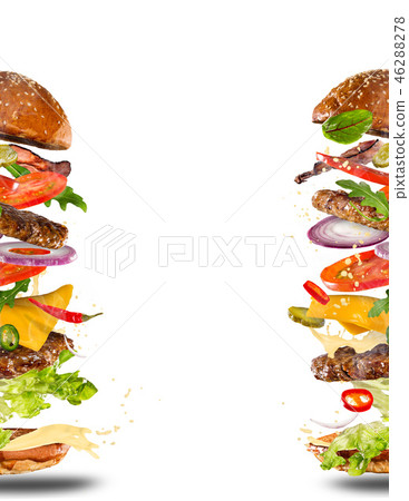 Big tasty burger with flying ingredients. Big tasty burger with flying ingredients. 46288278