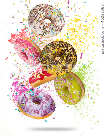 Tasty doughnuts in motion falling on white background. Tasty doughnuts in motion falling on white background. 46288369