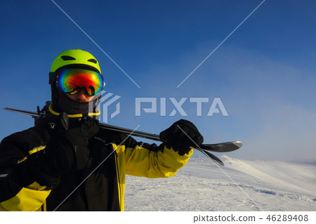 skier on a peak skier on a peak 46289408