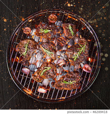 Barbecue grill with beef steaks, close-up. 46289418