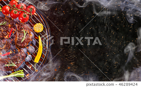 Barbecue grill with beef steaks, close-up. 46289424