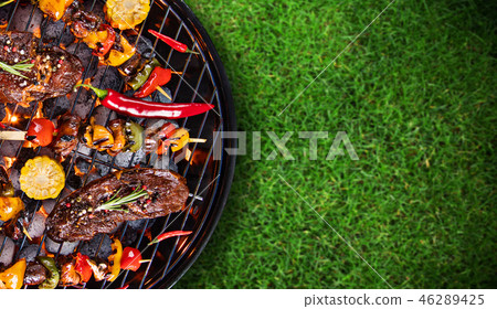Barbecue grill with beef steaks, close-up. 46289425