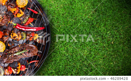 Barbecue grill with beef steaks, close-up. 46289428