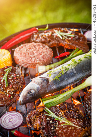 Barbecue grill with beef steaks, close-up. Barbecue grill with beef steaks, close-up. 46289451