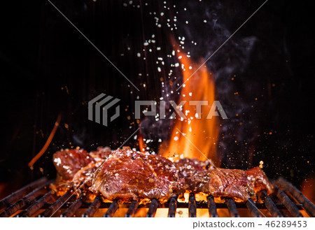Beef steaks on the grill with flames Beef steaks on the grill with flames 46289453