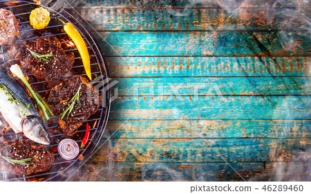 Barbecue grill with beef steaks, close-up. Barbecue grill with beef steaks, close-up. 46289460