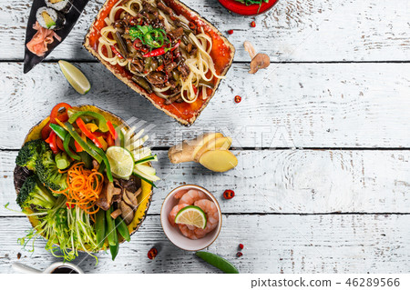 Various of asian meals on rustic background , top view , place for text. Various of asian meals on rustic background , top view , place for text. 46289566