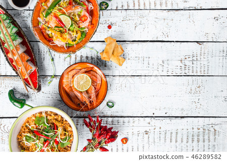 Various of asian meals on rustic background , top view , place for text. Various of asian meals on rustic background , top view , place for text. 46289582