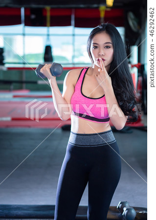 Fitness Asian women performing doing exercises Fitness Asian women performing doing exercises 46292462