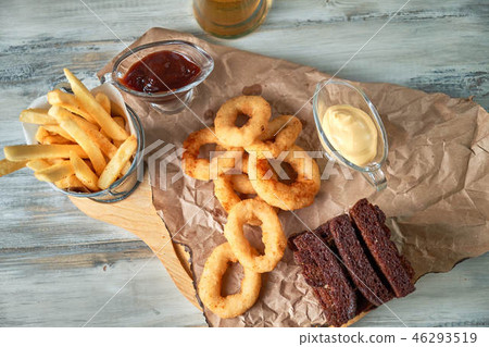 a variety of snacks for light beer in a glass 46293519