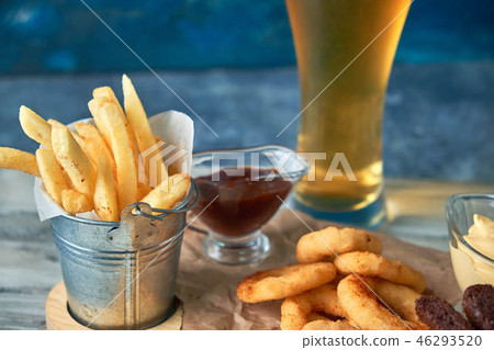 a variety of snacks for light beer in a glass a variety of snacks for light beer in a glass 46293520