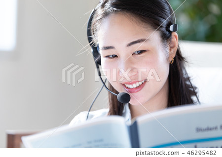 Woman doing a chat with a headset Woman doing a chat with a headset 46295482