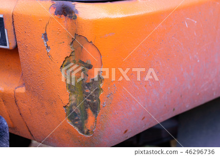 The dented car on the orange surface pickup. 46296736