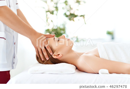 beautiful girl enjoys massage and spa treatments 46297478