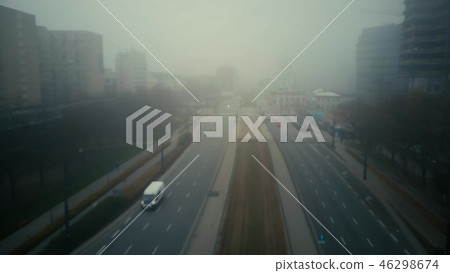 Flight over blurred city street in fog Flight over blurred city street in fog 46298674