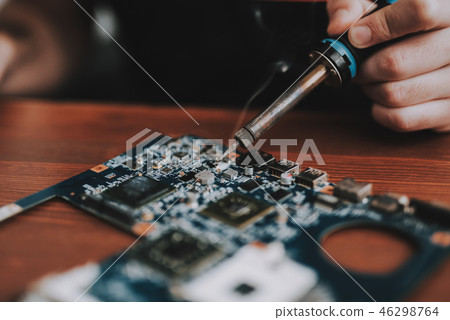 Close up. Man Repairing Motherboard from Laptop. 46298764