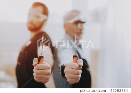 Standing Young and Old Workers with Screwdriver. 46298884