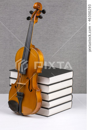 Still-life with a pile of books and a violin 46300293