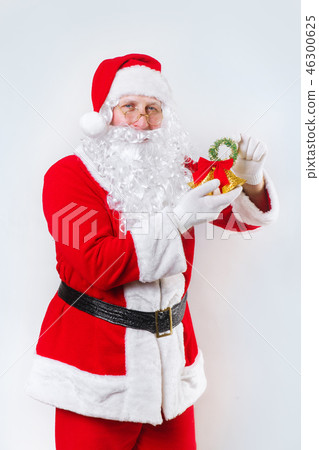 Santa Claus ringing a bell on a white background . Christmas time. Santa Claus ringing a bell on a white background . Christmas time. 46300625