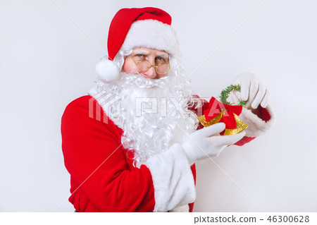 Santa Claus ringing a bell on a white background . Christmas time. 46300628