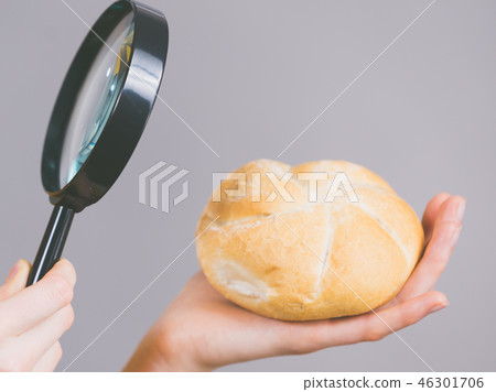 Bun bread roll and magnifying glass 46301706