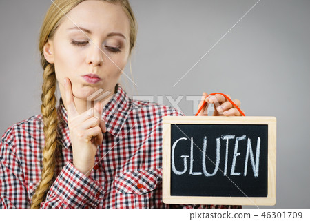 Woman holding board with gluten sign Woman holding board with gluten sign 46301709