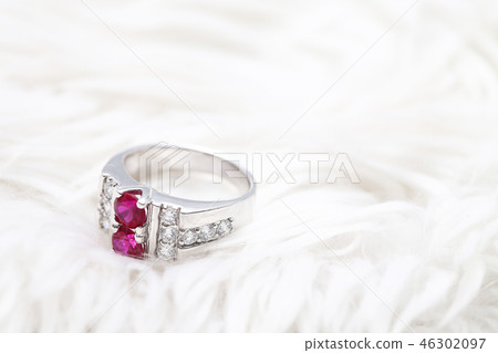 Pink gem stone on diamond ring 46302097