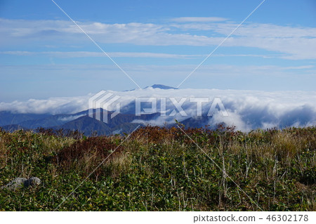 The Mt. Tsukiyama floating in the sea of clouds from the Mt. Aso mountain range Mt. The Mt. Tsukiyama floating in the sea of clouds from the Mt. Aso mountain range Mt. 46302178