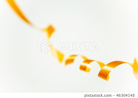 golden confetti serpentine ribbon isolated on white golden confetti serpentine ribbon isolated on white 46304148
