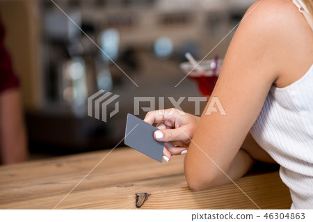 Paying by credit card in cafe Paying by credit card in cafe 46304863