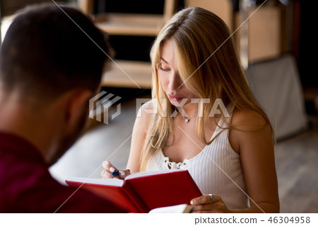 Beloved young couple making notes Beloved young couple making notes 46304958
