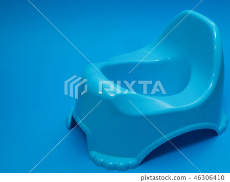 blue child plastic toilet seat on blue background 46306410