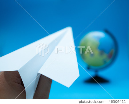 white paper airplane with globe blurred white paper airplane with globe blurred 46306411
